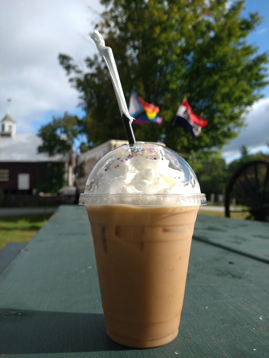 Cold brew in to go cup with whip cream on top